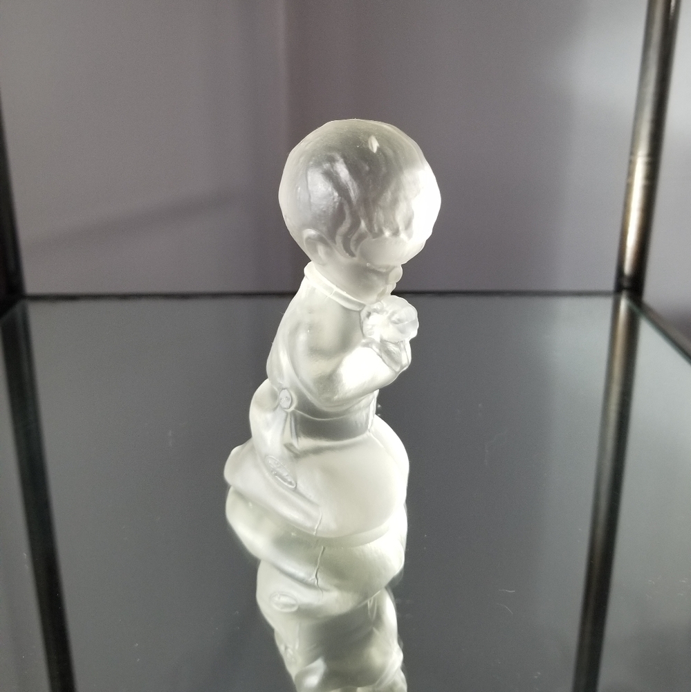 Praying boy figurine